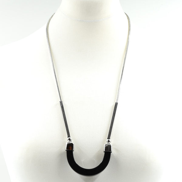 Curved resin pendant and bar detail on long rhodium necklace