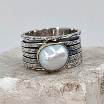 Sterling silver spinning ring with high quality inset real pearl on brass edged setting