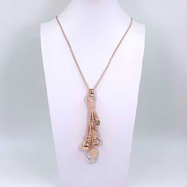 Long necklace with leather tassel detail with rose gold coin feature