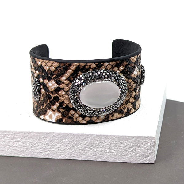 Classy snake effect PU open cuff with crystal studded mother of pearl oval feature