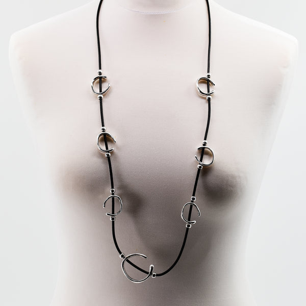 Long black leather necklace with multi organic shaped pendant