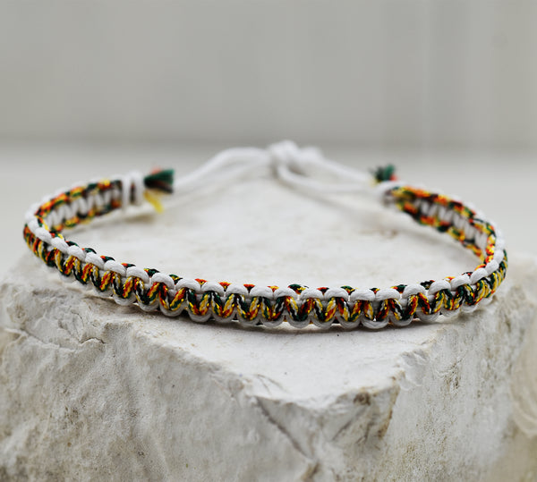 Delicate friendship bracelet with coloured bead edging