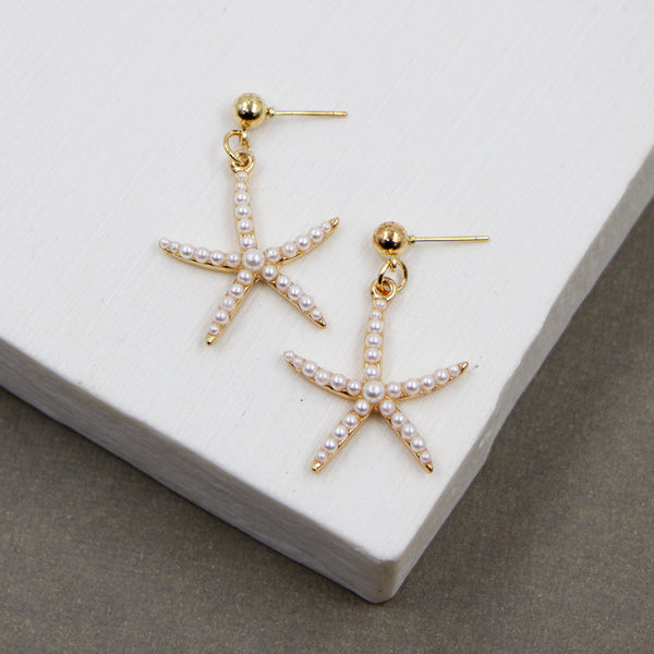 Skinny starfish earrings with multiple pearls inset