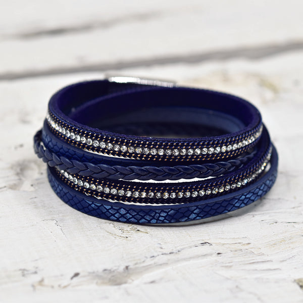 Blue multistrand bracelet with different textures and crysta