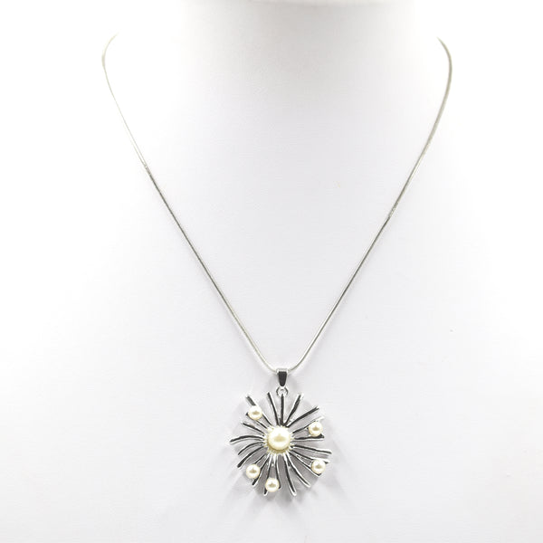Starburst style pearl pendant on short necklace