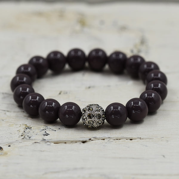 Simple stretchy bead bracelet with central diamante