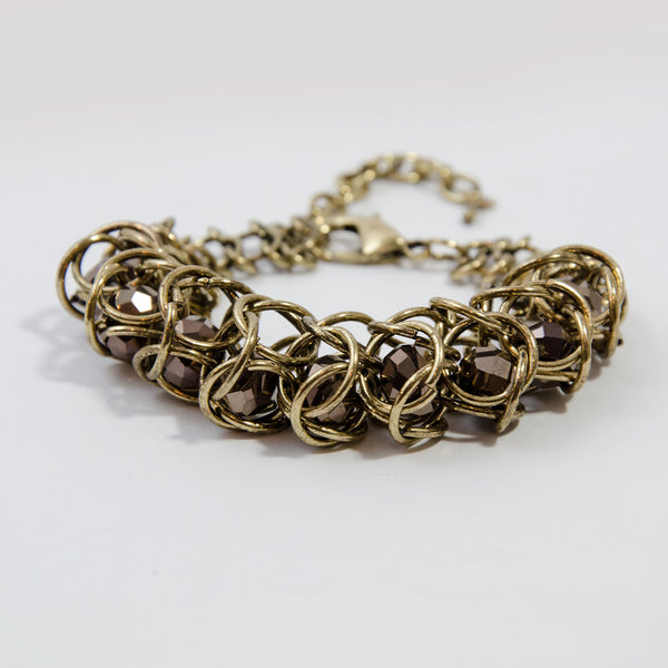 Cut glass beads encased in multi link chain bracelet