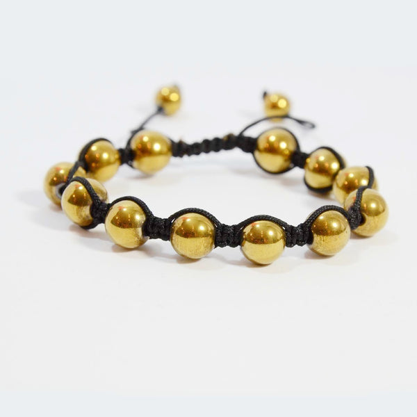 Gold beads on a pull string bracelet
