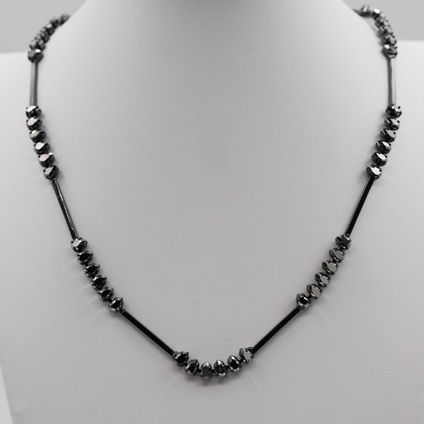 Short feature necklace with bead features and tube beads
