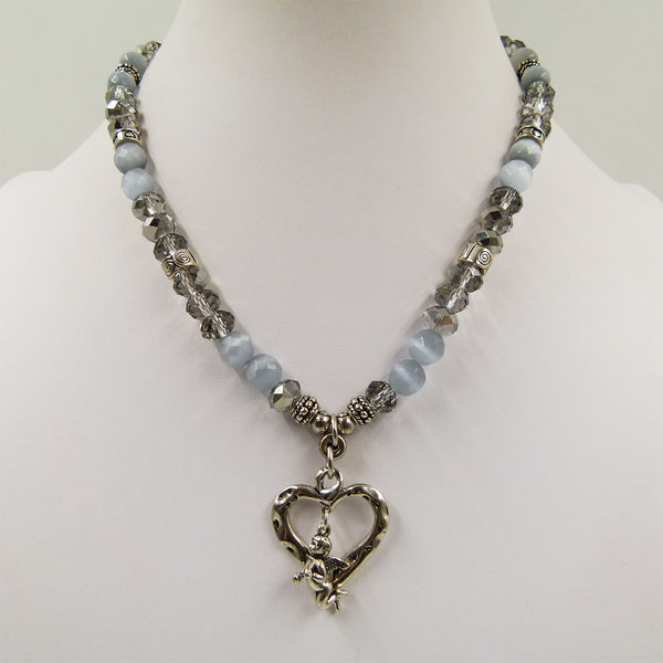 Short cut glass necklace with silver cut out heart & pieces