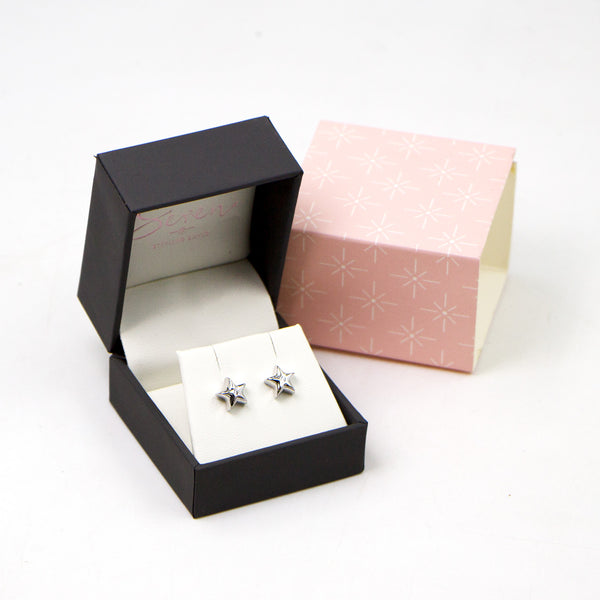 Plain sterling silver star earrings with central CZ stone