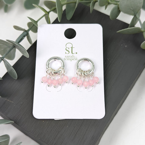 Ring feature earrings with rose quartz beads
