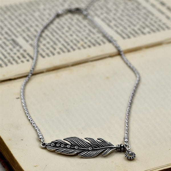 Vintage style feather pendant with crystals on short chain