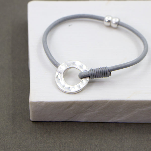 Simple circle detail on single cord leather bracelet