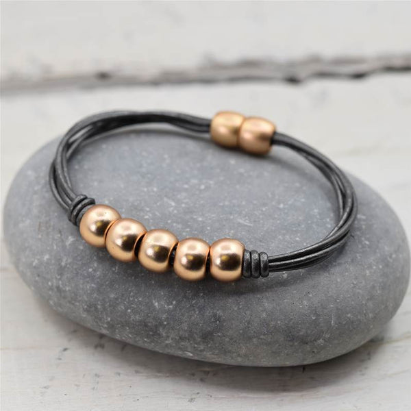 5 solid balls on leather bracelet with magnetic clasp