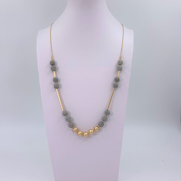 Long semi precious bead necklace with gold plated bead section