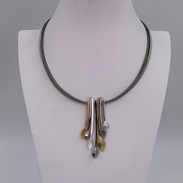 Concave contemporary components on multi wire necklace