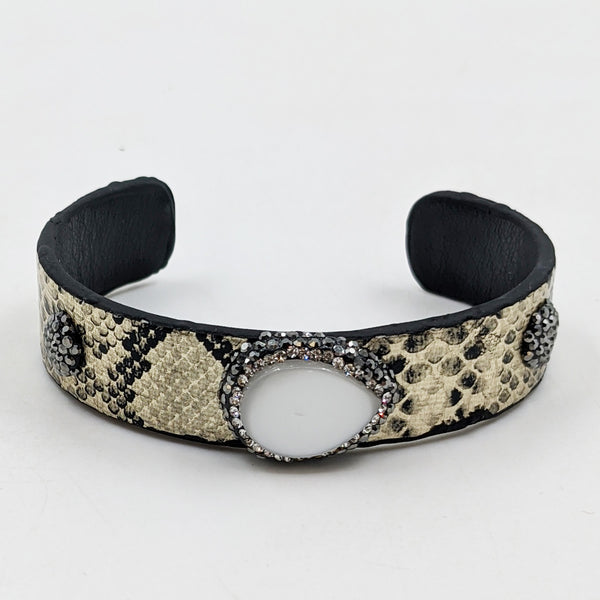 Slender open metallic cuff with crystal studded mother of pearl feature