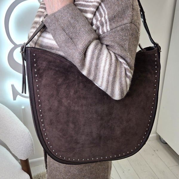 Chic rounded suede and leather combo shoulder bag with luxe double buckle and stud detail