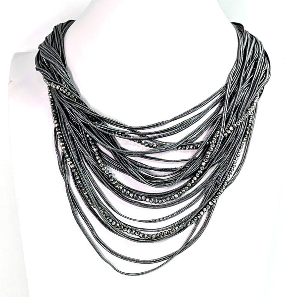 Multistrand fabric cord necklace with cut glass gunmetal bead strands