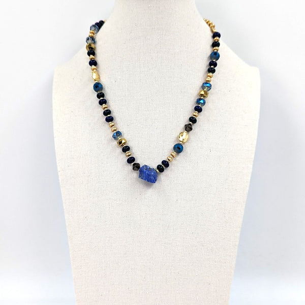 Short beaded necklace with golden spacers and rough semi-precious stones