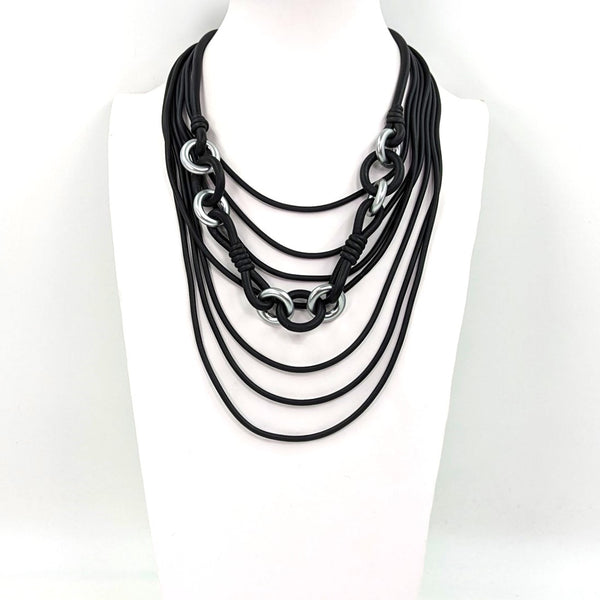 Multistrand neoprene necklace with linked strand