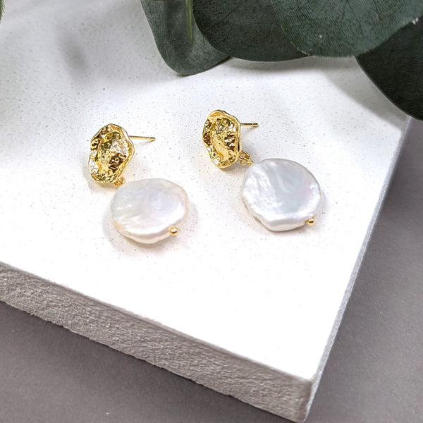 Flat round real pearl earrings with a textured organic post