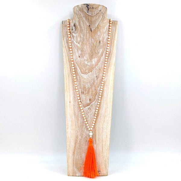 Long boho beaded necklace with distinctive knotting and tassel feature