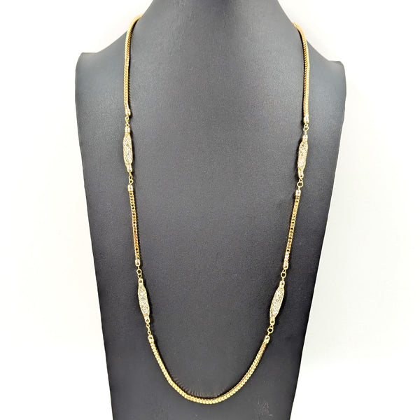 Long encased crystal section necklace on square snake chain
