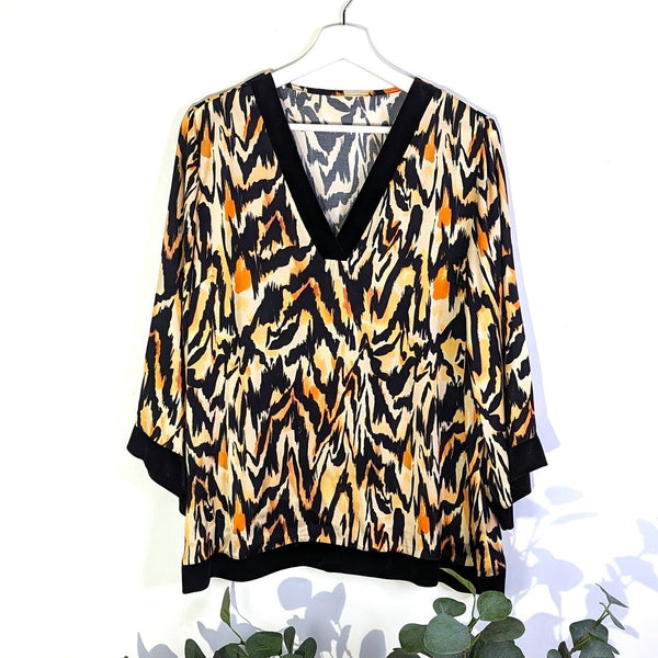 Viscose satin type fabric abstract animal print top with luxe velvet edging