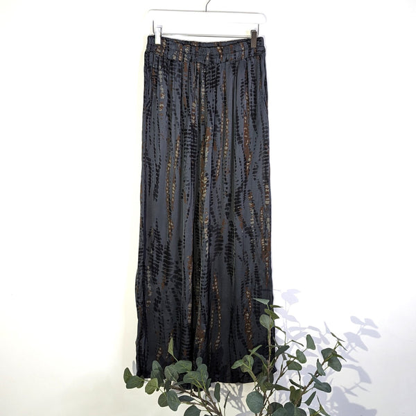 Contemporary vertical tie dye print satin feel trousers with elasticated waist and pockets