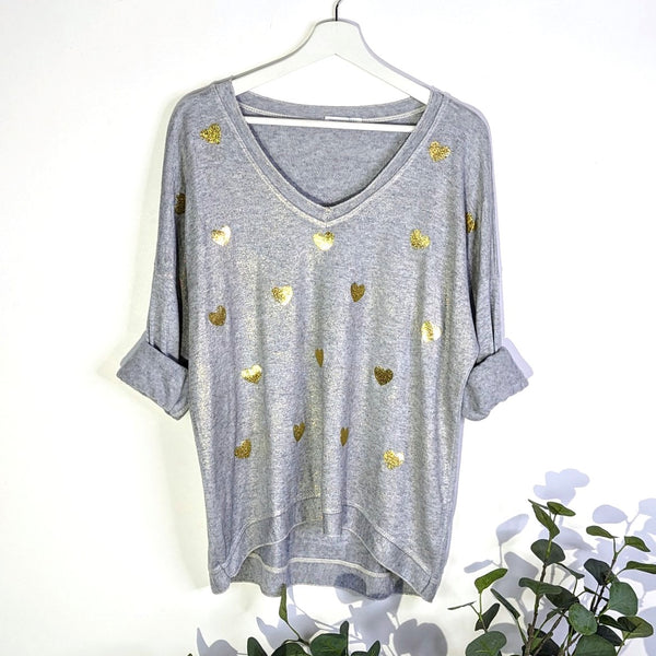 Soft V-neck hi-lo top with subtle golden sheen and hearts on front (M)