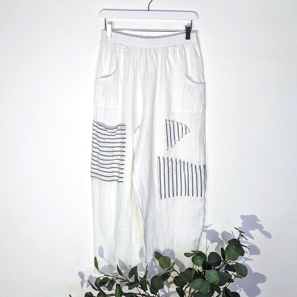 Relaxed linen trousers with various pockets striped patch elements