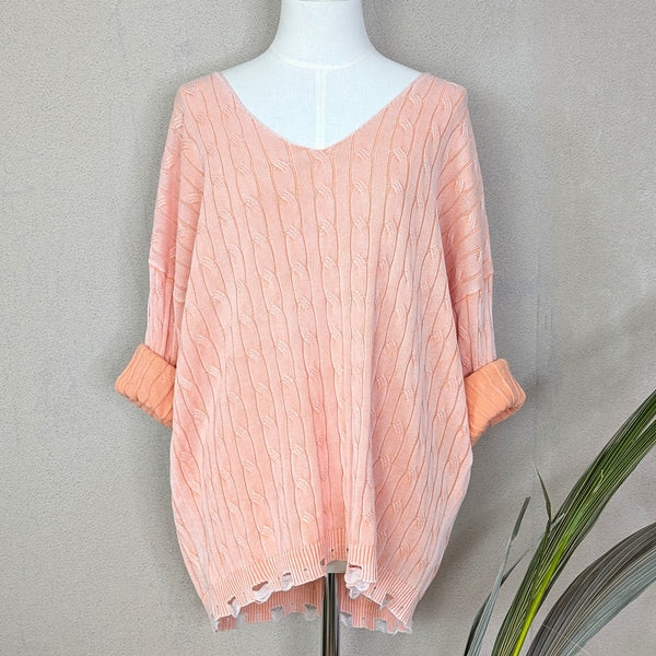 Fine cable knit V-neck cotton jumper with fashionable distressed hem and vintage wash