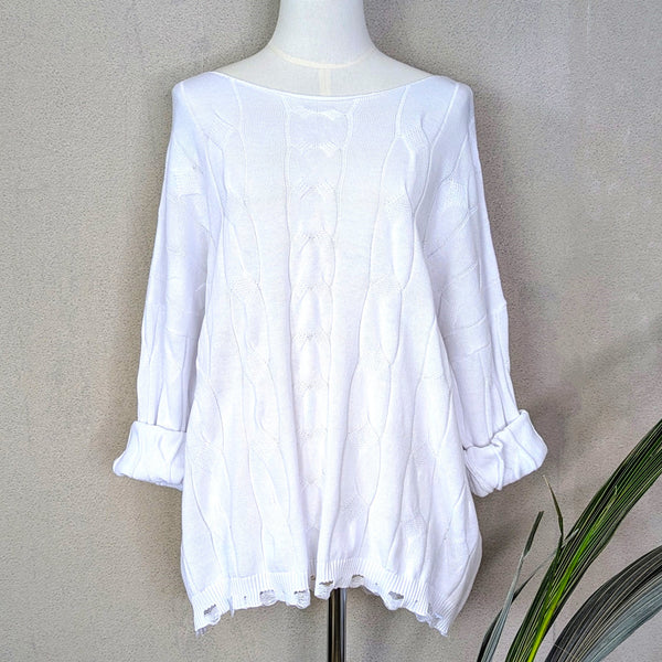Fine cable knit cotton jumper with fashionable distressed hem and vintage wash