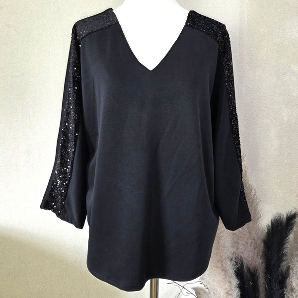 Soft scuba fabric dressy V-neck top with sequin detail on arms and bow on back (M)