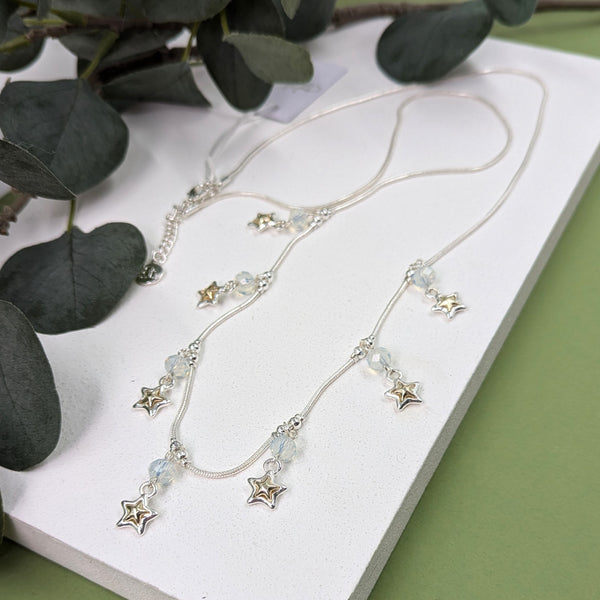 Long necklace with little dangly stars and beads