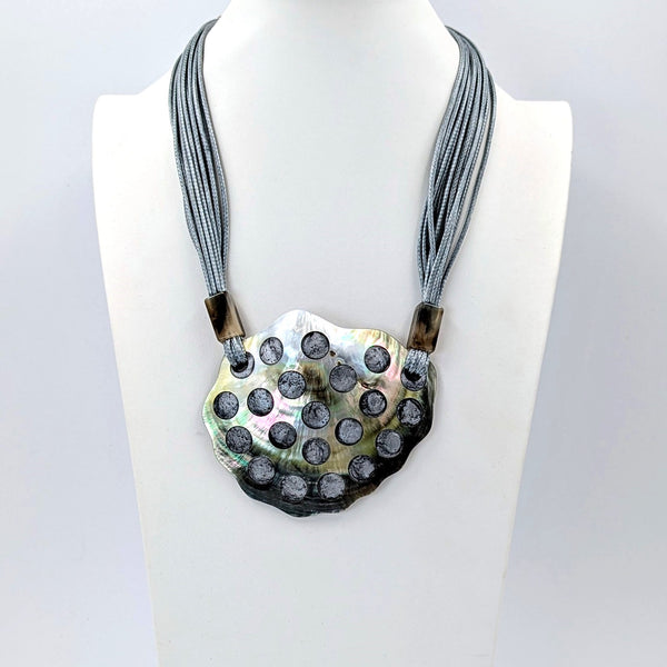Natural shell statement necklace with resin filled circles detail on multi wax cord