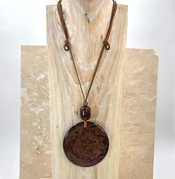 Luxe resin round pendant on wax cord