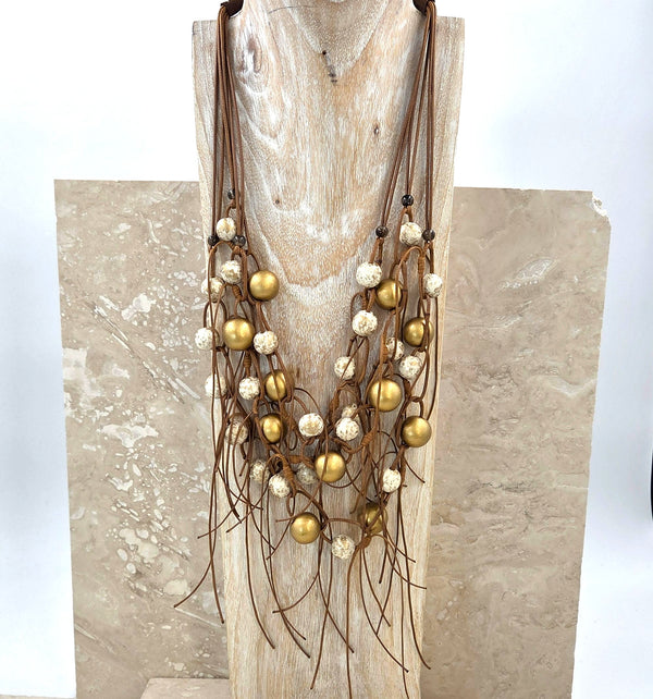 Luxe multistrand looped necklace with ivory and golden foil beads