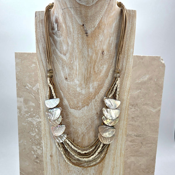 Luxe multistrand beaded necklace with shell overlap detail