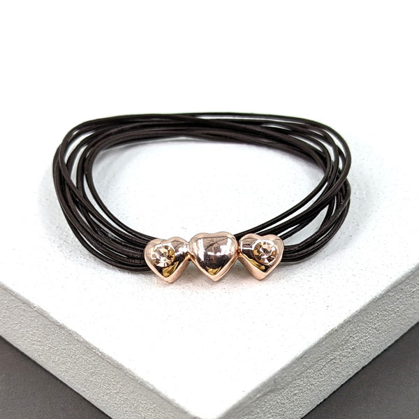 Multi strand leather bracelet with three hearts and diamante
