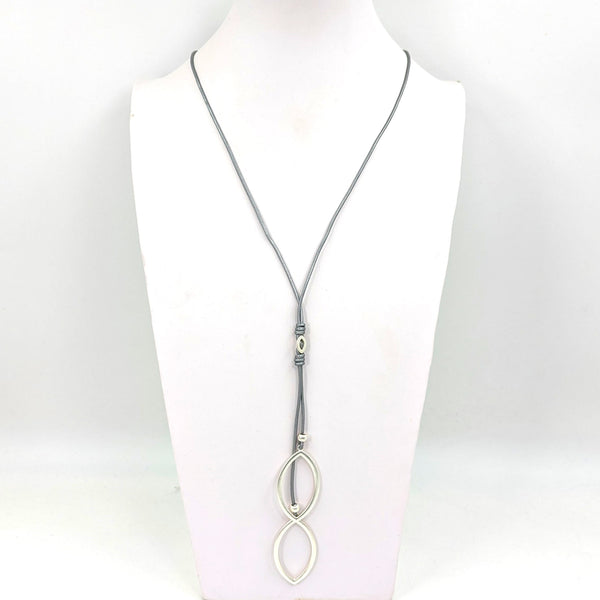 Simple cut out oval pendants on long slim leather necklce