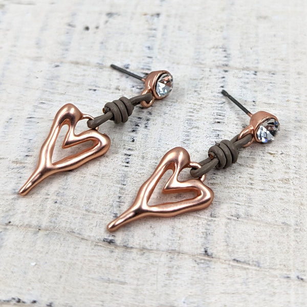 Cut out heart drop earrings with leather on a crystal stud