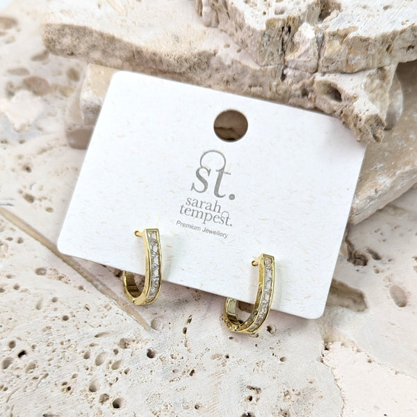 Elongated snug hoops with square CZ stones