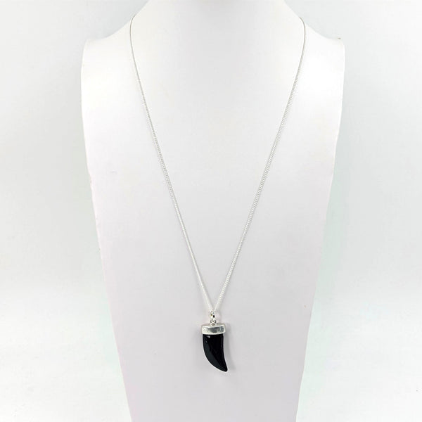 Resin pendant with metal cap on long necklace