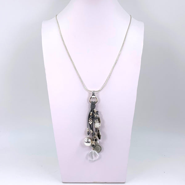Long necklace with leather tassel detail with silver coin feature