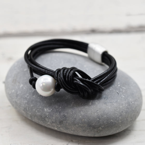 Leather bracelet with knot feature and faux pearl