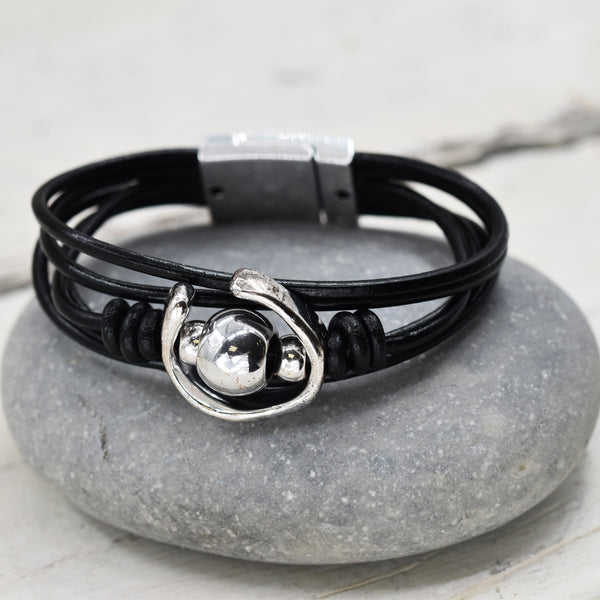 Multi strand leather bracelet with organic shaped component