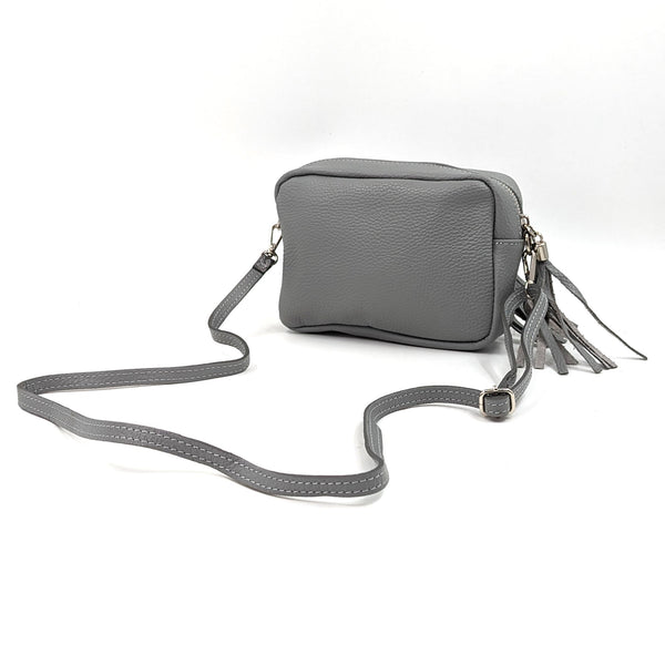 Boxy leather bag with tassel and crossbody strap